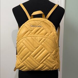 Michael Kors Quilted Mini Backpack in Mustard